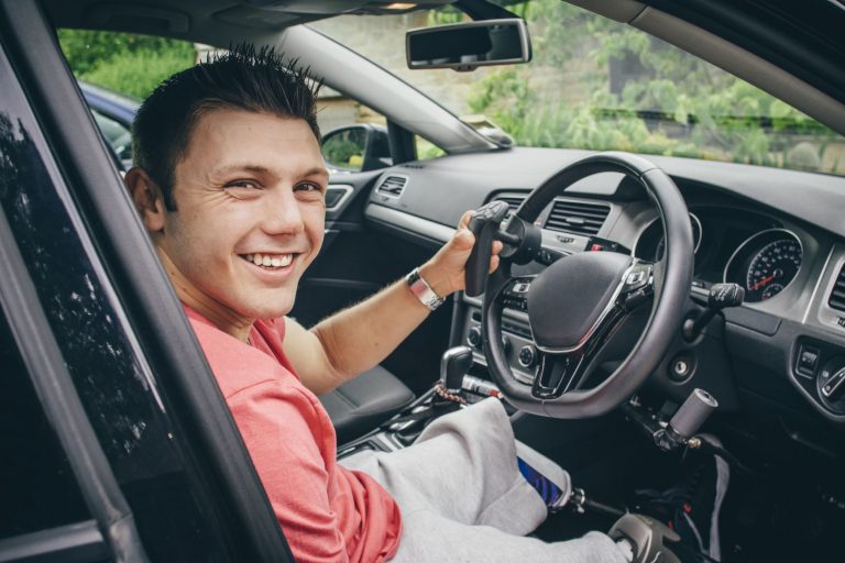 Driving Assessments and Rehabilitation - man in car smiling